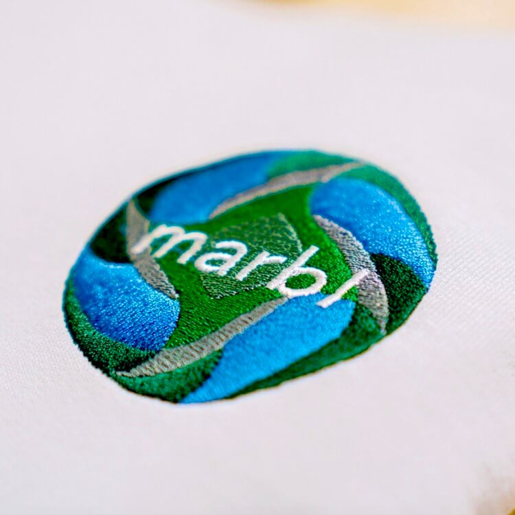 a vibrant embroidered circular logo.